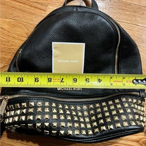 Michael Kors Backpack with gold studs.